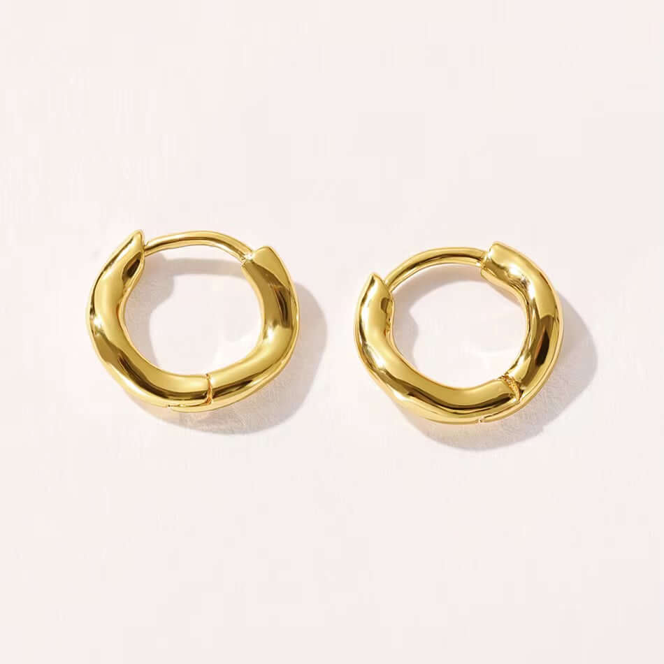 Irregular Shaped Huggies earrings, 925 Sterling Silver, 14k Gold-Plated, light gold color, Rhodium Plated finish.