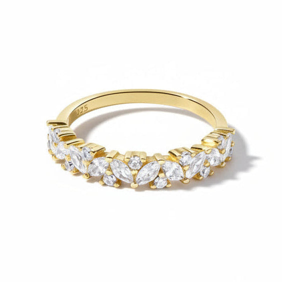 A yellow gold half-band ring featuring a row of marquise-cut clear gemstones, photographed on a clean white background with a soft shadow.