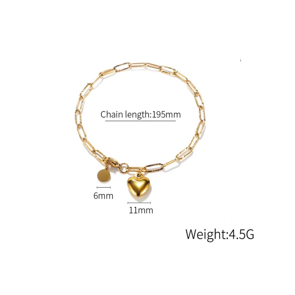 A gold-tone chain bracelet with a heart-shaped charm and a small round disc charm, shown on a white background with measurement labels and text indicating chain length, charm sizes, and weight.