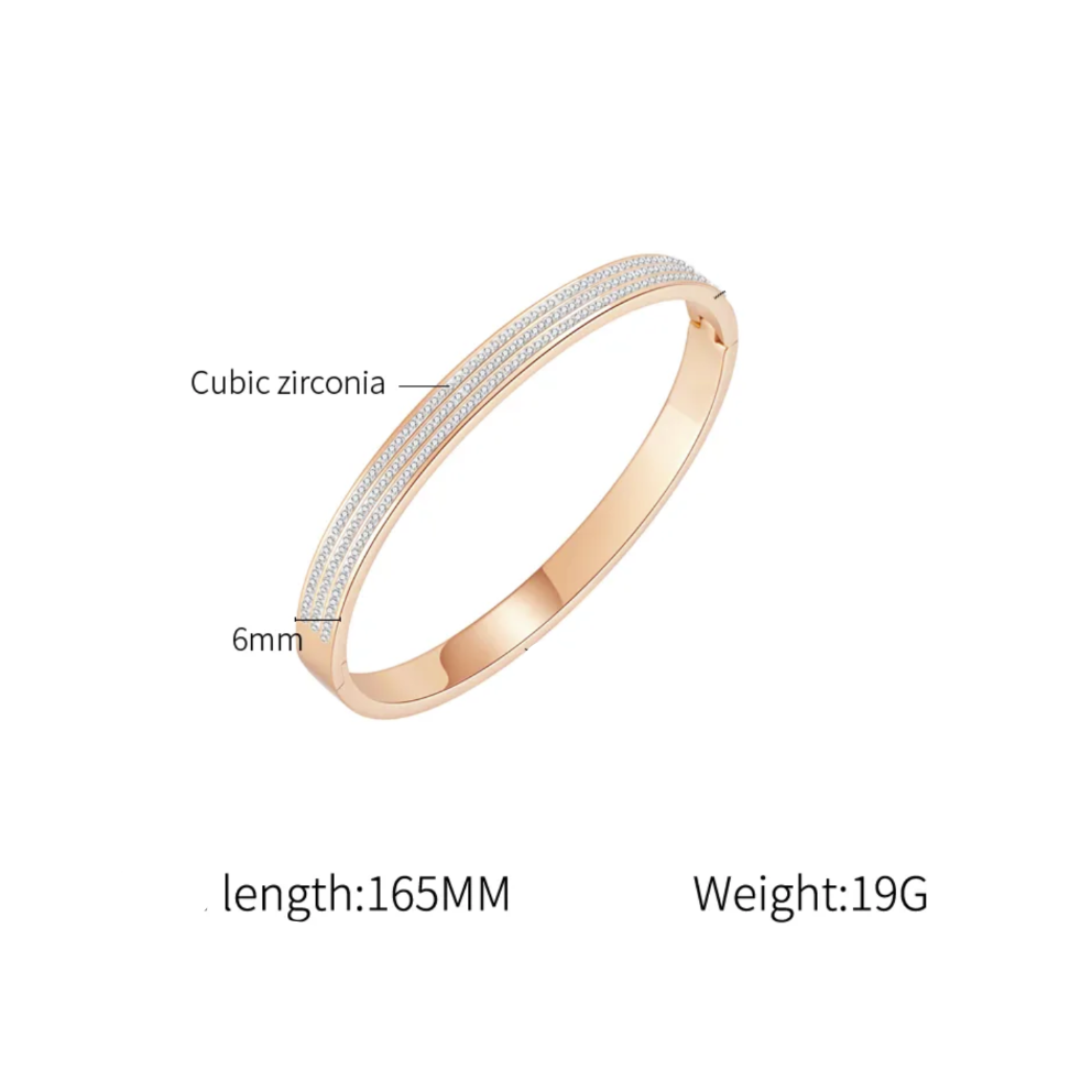 A bangle bracelet with a textured white cubic zirconia inlay, shown on a white background with text labels indicating its materials and dimensions.