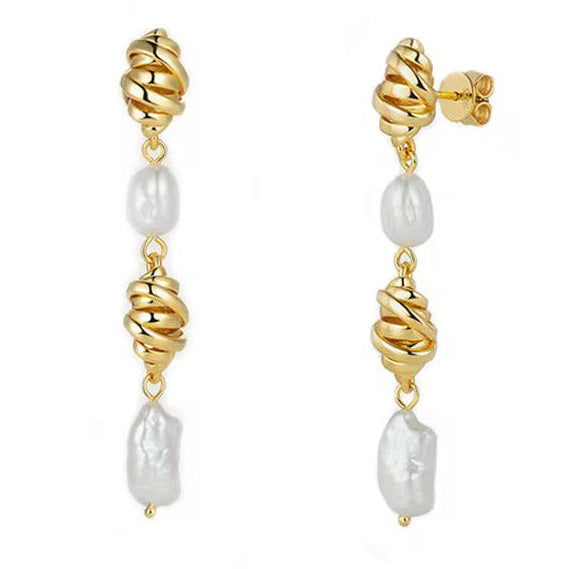 Gold and Big pearl earrings on a white background