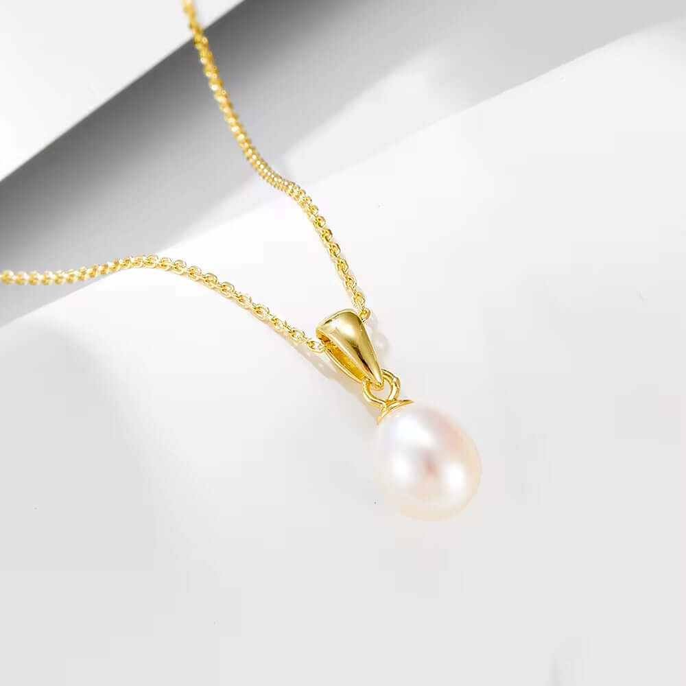 Pearl necklace featuring a 925 Sterling Silver chain, gold-plated pendant with freshwater pearl, elegant and classy design.