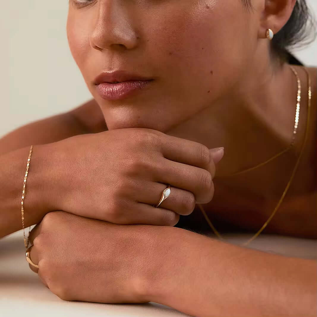 Model showcasing a 925 Sterling Silver Opal Ring, accented with 14k real Gold-Plated and Rhodium details, exuding elegance.