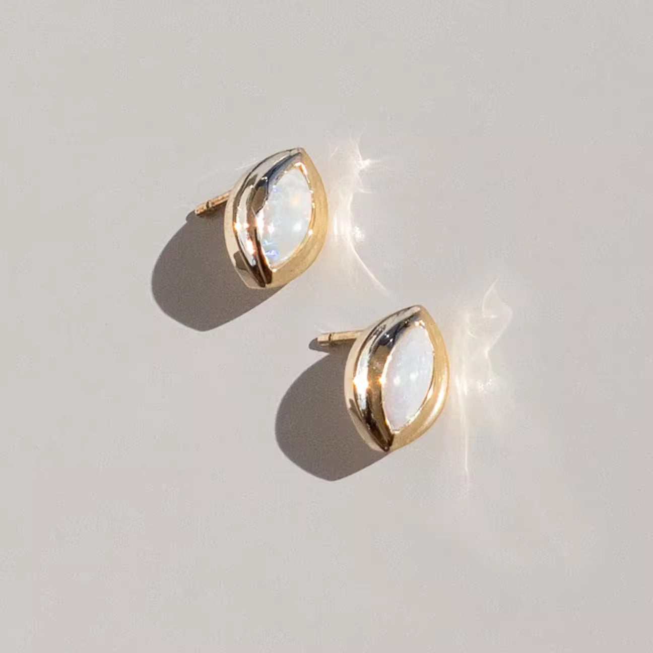 Opal earrings in 925 sterling silver, 14k gold-plated with rhodium finish, perfect for adding elegance to any outfit.