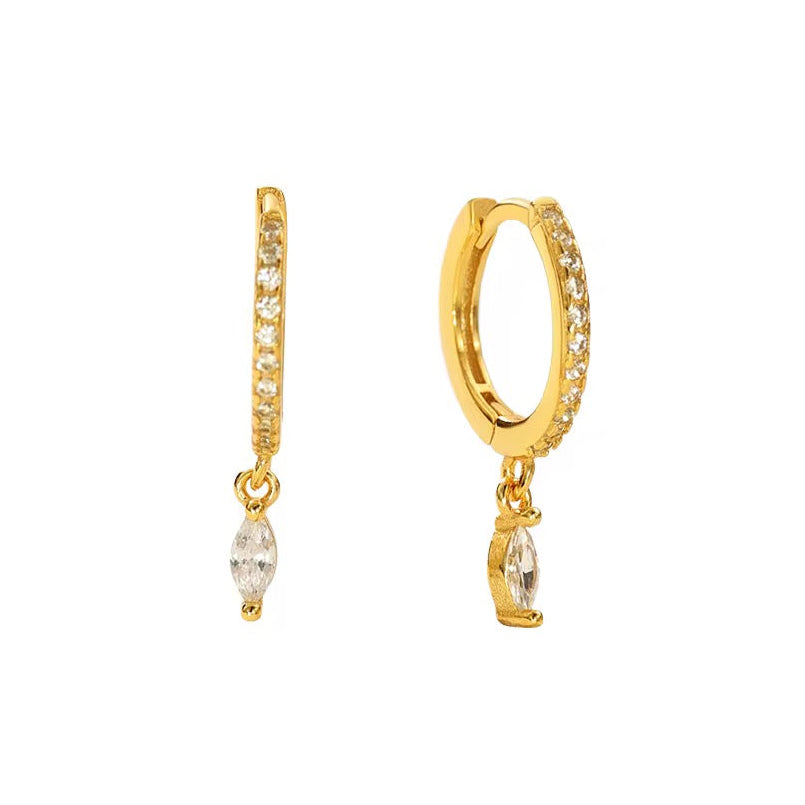 Gold hoop earrings with small crystal drops on a white background