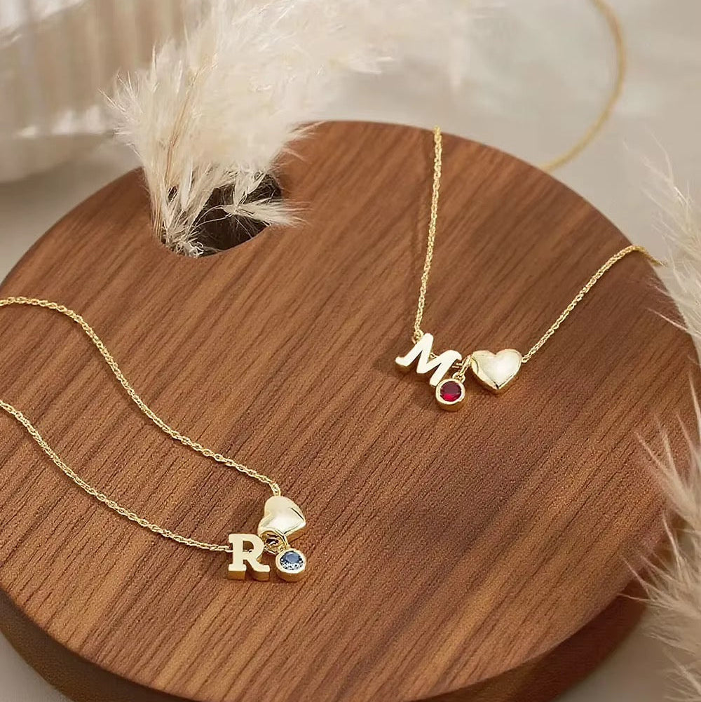 gold M red birthstone heart initial necklace