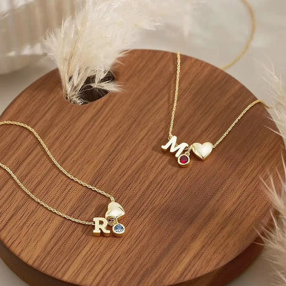 gold M red birthstone heart initial necklace