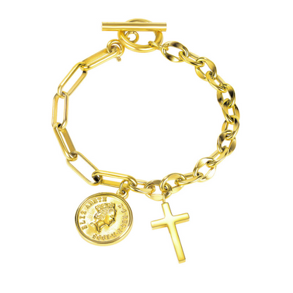 A gold-tone charm bracelet with a paperclip chain, toggle clasp, a round Elizabeth II coin pendant, and a small cross charm, shown on a plain white background.