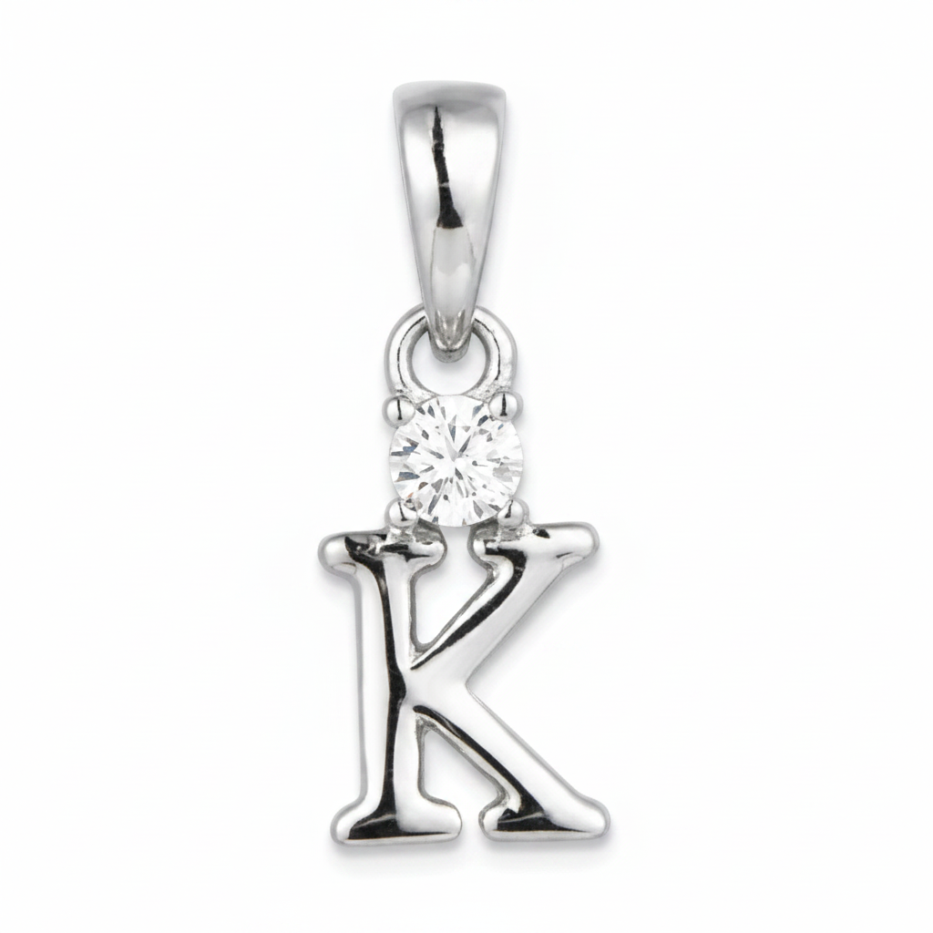 A sterling silver initial pendant charm shaped like the letter 'K', featuring a small clear round-cut gemstone at the top, set against a plain white background.