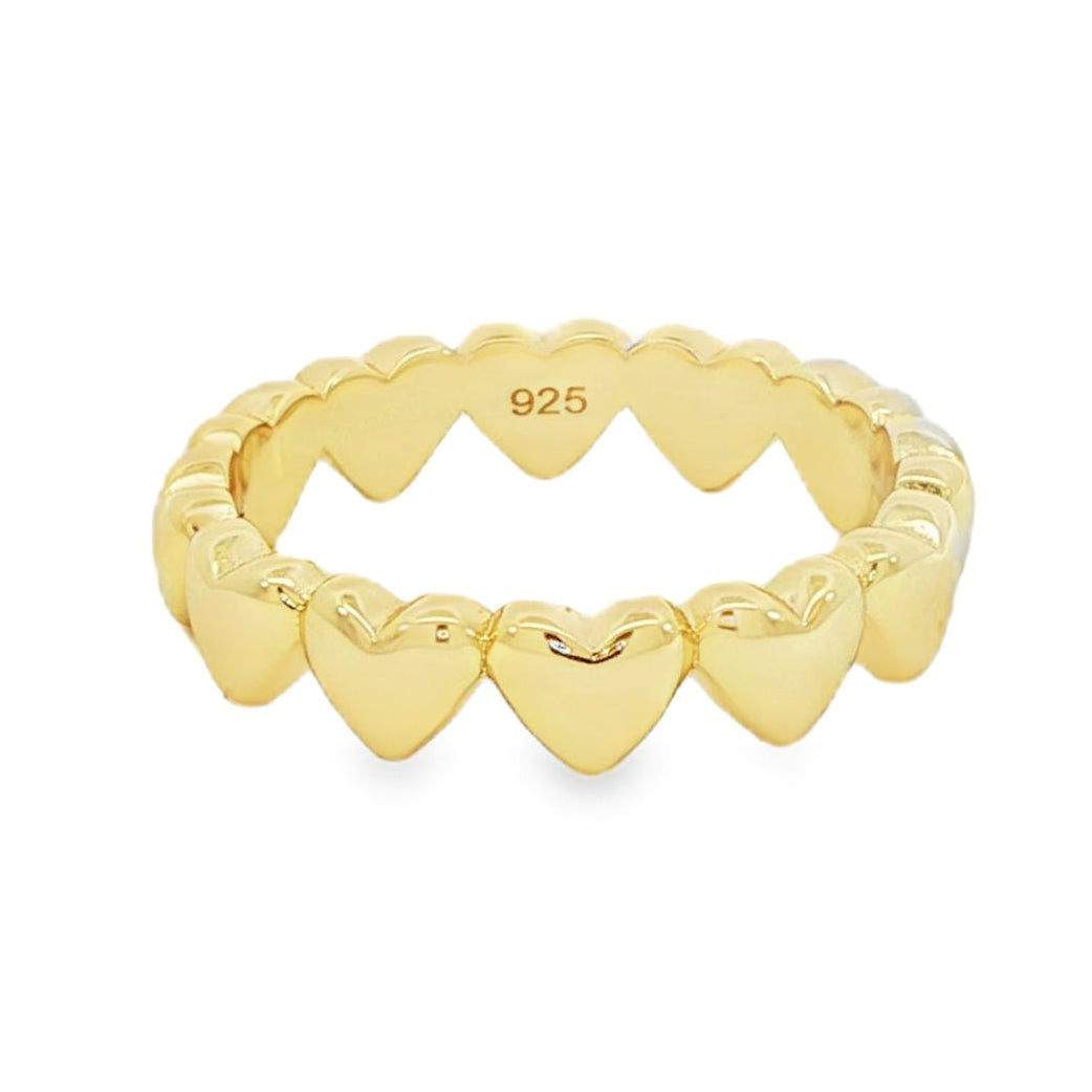 Gold heart-shaped ring on a white background